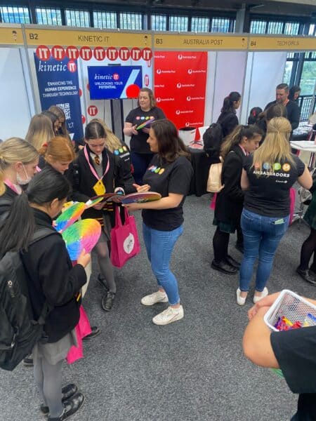 people helping students learn about IT careers at Go Girl tech conference