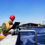 Engineer checking equipment at a water treatment facility